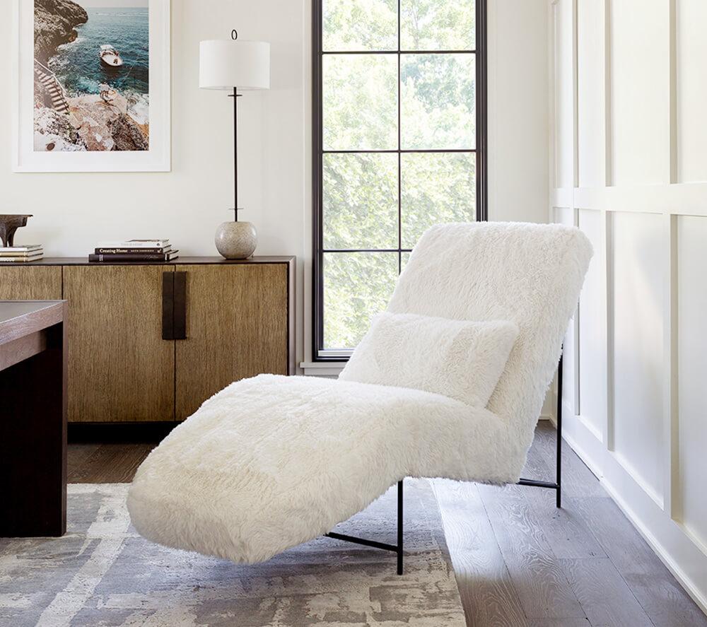 A faux fur chase lounge with ergonomic curves give a fun funky look to a clean and simple profile.